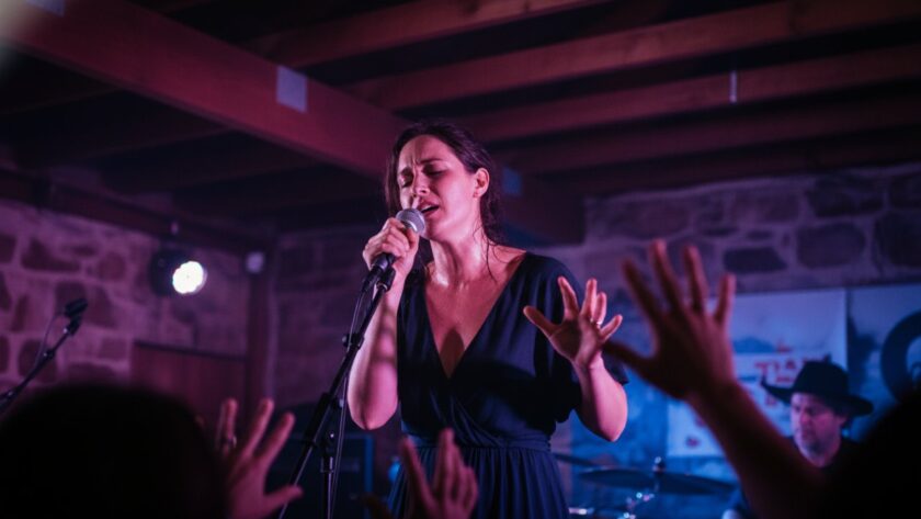 An electrifying close-up shot of a lead guitarist mid-solo on stage at a vibrant Bittern music venue, bathed in dynamic stage lights, perfectly encapsulating Bittern live music photography capturing raw energy.