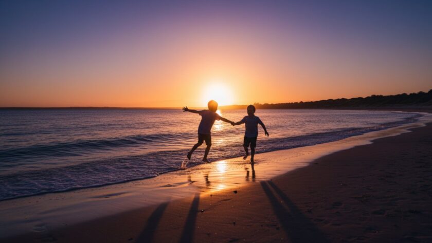 An epic moment of joyful children playing candidly on Balnarring Beach at sunset, beautifully captured in a professional candid Balnarring Beach kids photography style, with dramatic lighting.