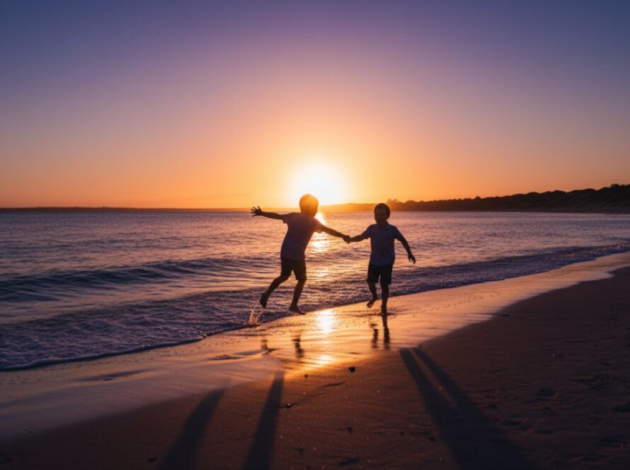 An epic moment of joyful children playing candidly on Balnarring Beach at sunset, beautifully captured in a professional candid Balnarring Beach kids photography style, with dramatic lighting.