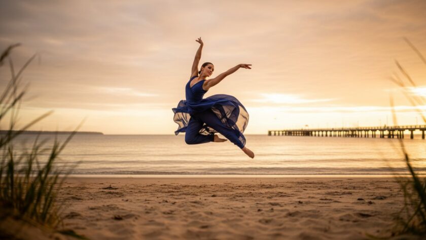 An epic moment of a dancer mid-air, silhouetted against a golden Safety Beach sunset, performing a powerful contemporary leap, perfectly illustrating Capturing Dynamic Dance Photography Safety Beach.