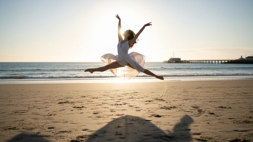 An epic moment of a dancer performing an elegant leap on Somers Beach at sunset, beautifully illuminated by dramatic golden hour light, showcasing Capturing dynamic dance photography Somers Victoria.