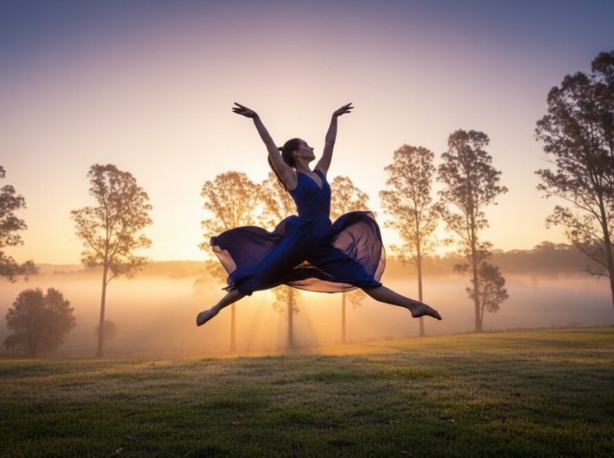 A vibrant, high-energy photograph Capturing Healesville Dance Photography Kinetic Artistry, showing a dancer mid-leap against a misty Yarra Valley sunrise, showcasing powerful movement and grace.