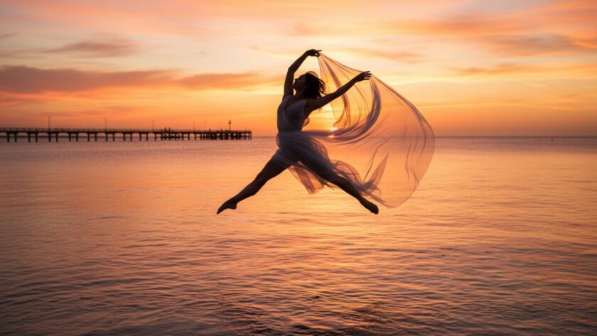 A powerful ballet dancer mid-air, silhouetted against a golden Capel Sound sunset, captured during an expressive dance photoshoot in Capel Sound, highlighting dynamic motion and artistic expression.