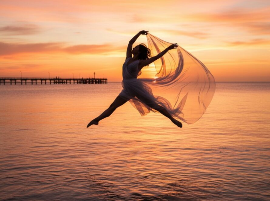 A powerful ballet dancer mid-air, silhouetted against a golden Capel Sound sunset, captured during an expressive dance photoshoot in Capel Sound, highlighting dynamic motion and artistic expression.