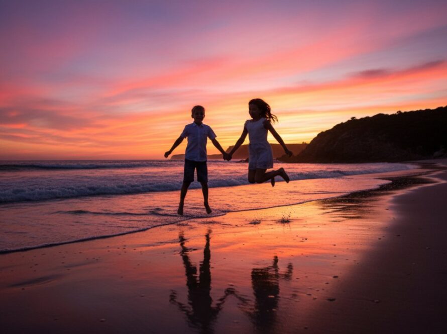 Joyful outdoor kids photography Mornington Peninsula: A child with windswept hair running gleefully along the shore at sunset, splashing in the shallow waves, with dramatic golden light, captured from a low angle to convey immense joy and freedom.