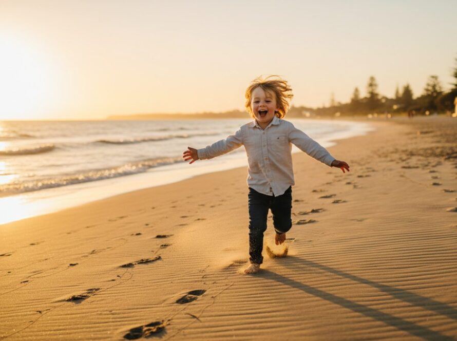 An epic moment of a child laughing joyfully as they run along the sandy shore of Mornington Beach at sunset, with golden light illuminating their playful sprint, perfectly embodying mornington kids photography capturing authentic joy.