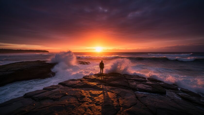 Portsea fine art coastal photography showcasing a dramatic sunrise over Point Nepean, with golden light reflecting on tranquil ocean waves and rugged cliffs, evoking a sense of serene grandeur.