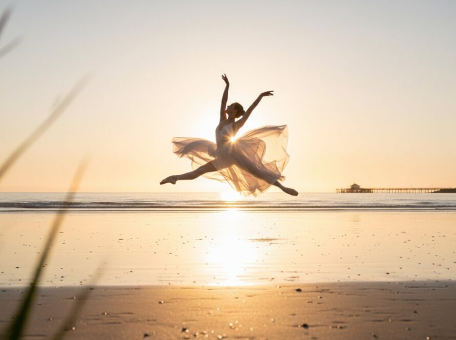 An elegant dancer performing a beautiful leap on the sandy shores during a Rosebud ballet beach photoshoots session at sunrise, with the calm waters of Port Phillip Bay in the background, capturing a moment of pure grace and athleticism.