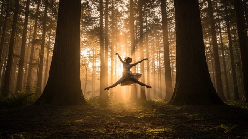 An ethereal moment of Toolangi forest contemporary dance photography, featuring a dancer poised gracefully amidst towering gum trees, golden hour light filtering through the canopy, capturing fluid movement in a serene natural setting.