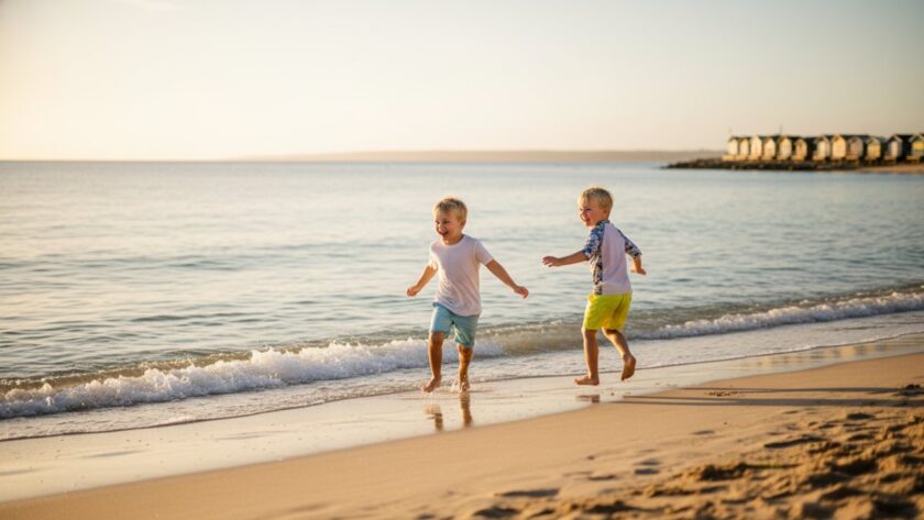 A wide-angle, cinematic photograph capturing a child's joyful, playful moments during a Tootgarook beach kids photography session, silhouetted against a golden hour sunset, splashing water, creating an epic, unforgettable memory.