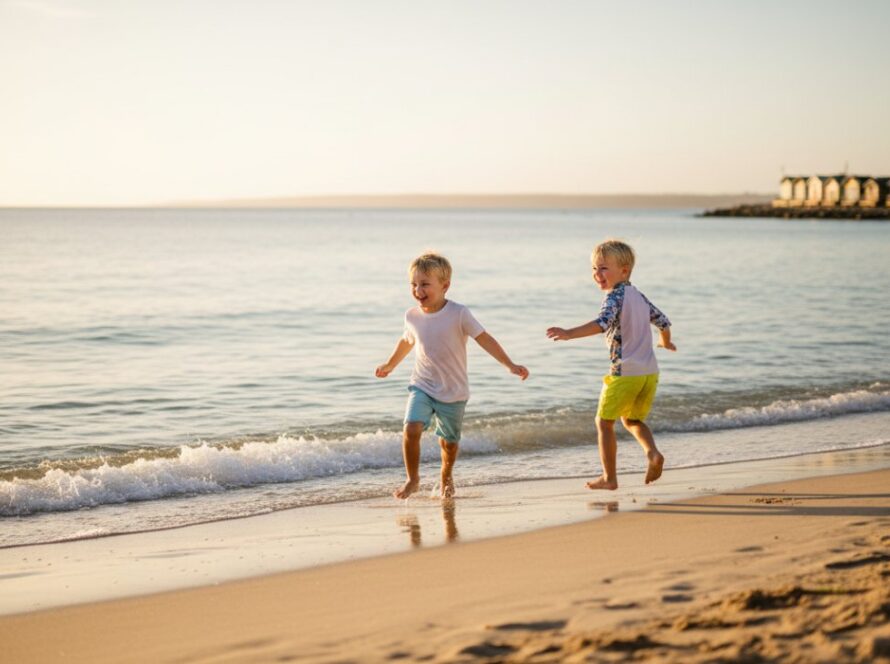 A wide-angle, cinematic photograph capturing a child's joyful, playful moments during a Tootgarook beach kids photography session, silhouetted against a golden hour sunset, splashing water, creating an epic, unforgettable memory.