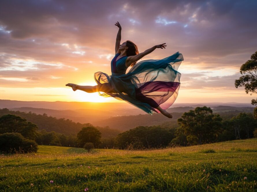 An epic moment captured during vibrant dance photography sessions in Cockatoo, featuring a powerful male dancer mid-leap against a backdrop of lush Dandenong Ranges greenery at sunset, light catching his dynamic form.