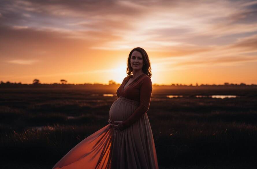 A stunning, cinematic 'epic moment' photograph of an expectant mother glowing at golden hour in Altona Meadows, with the iconic Cheetham Wetlands in the soft, blurred background, her silhouette framed by the setting sun's warm light, capturing the magic of Altona Meadows golden hour maternity photography.