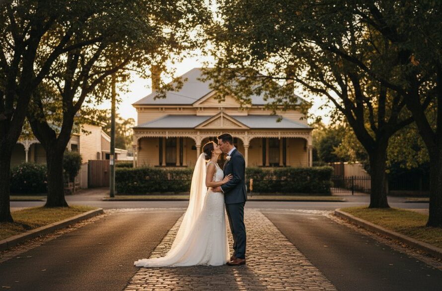 An authentic Geelong West heritage wedding photography moment: a happy couple sharing a tender kiss under an ancient oak tree at sunset, soft golden hour light illuminating their joy.