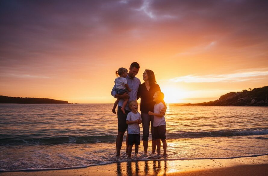 An authentic Mallacoota family photography adventures moment: A family of four, silhouetted against a dramatic Mallacoota sunset over the tranquil inlet, with the parents playfully swinging their two young children by their arms, all laughing joyfully, captured with professional color grading and cinematic lighting.