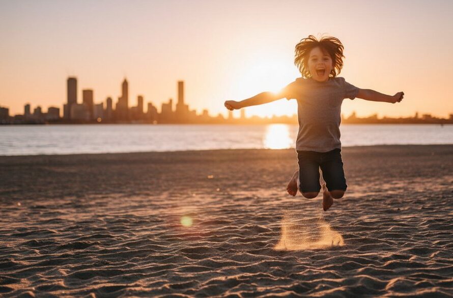 An 'epic moment' photograph capturing authentic Rippleside kids photography Geelong for joyful memories, featuring a child laughing joyfully while running through golden hour light at Rippleside Park, with Geelong's waterfront in the soft background.