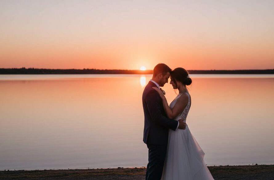 A newlywed couple embracing passionately at sunset on the tranquil shores of the Gippsland Lakes, their silhouettes framed by the dramatic, golden light, embodying romantic Bairnsdale Gippsland Lakes wedding photography.