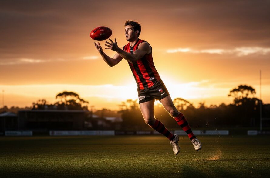 Dynamic Ballarat Central junior sports photography moments: A young footballer in mid-air, catching a ball with intense focus at Eureka Stadium, dramatic sunset lighting, professional photography.