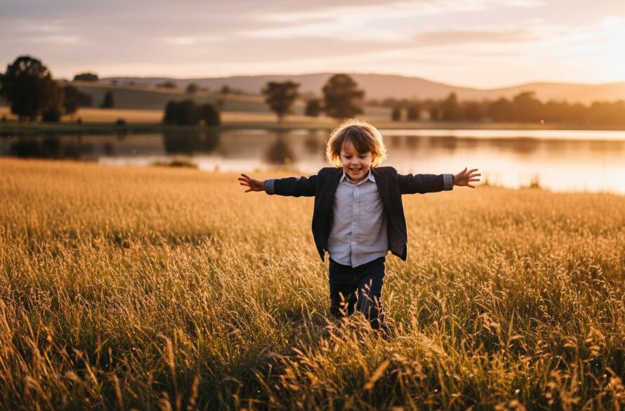 An epic moment of Benalla kids photography capturing joyful childhood, showing a child joyfully running through golden light at sunset near Lake Benalla, with laughter and warmth.