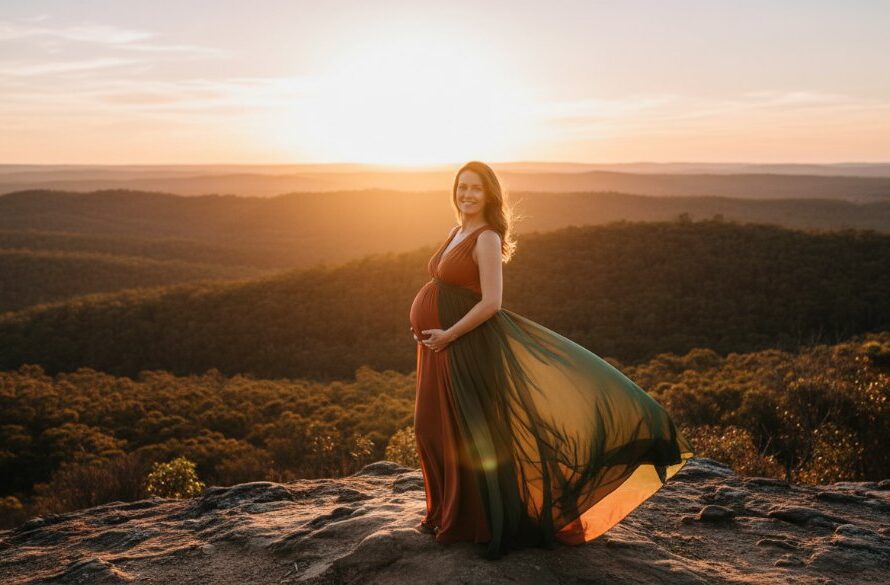 An expectant mother, silhouetted by the golden hour sun, standing gracefully amidst the rolling hills of Black Hill, Victoria, her pregnancy celebrated in a stunning Black Hill maternity photography outdoor glow shot, evoking warmth and anticipation.