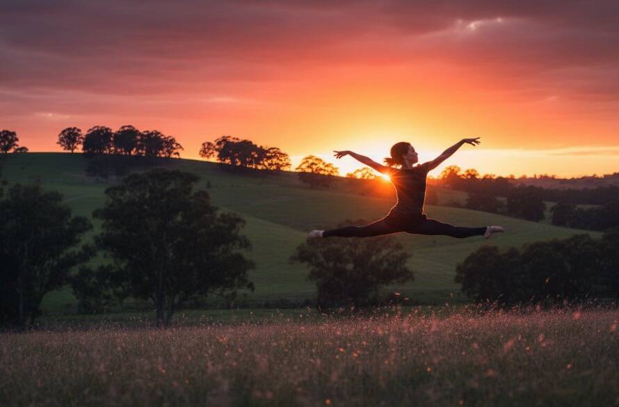 An energetic dancer captured mid-leap with a vibrant sunset backdrop over the Croydon Hills landscape, perfectly illustrating capturing dynamic dance moments Croydon Hills with dramatic lighting and professional colour grading.