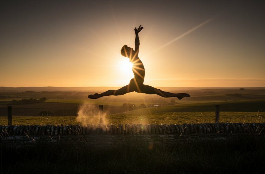 A male dancer captured mid-leap against a dramatic sunset sky over Miners Rest, Victoria, embodying the essence of capturing dynamic dance photography Miners Rest Victoria, with powerful athletic grace and artistic expression.