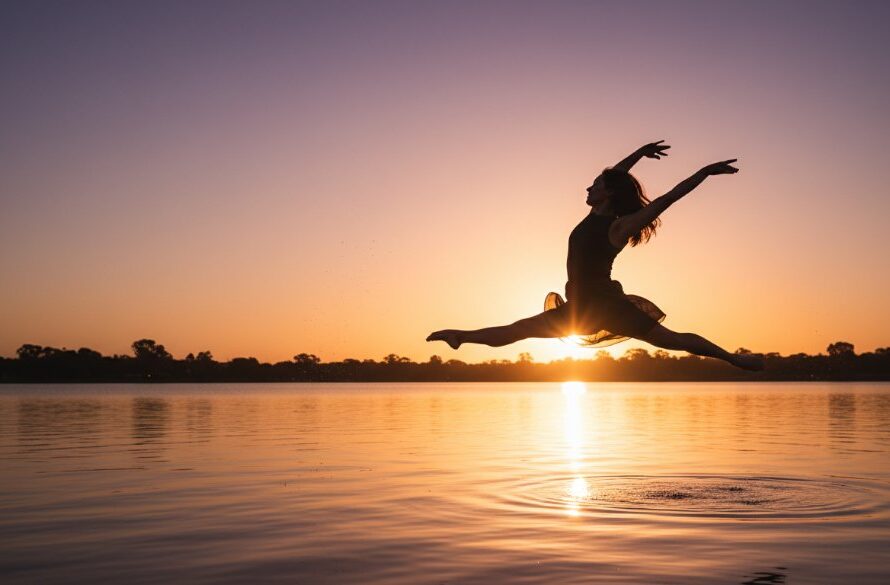 Dynamic wide shot of a ballet dancer mid-air in an awe-inspiring grand jeté, set against a blurred, golden hour Shepparton orchard background, showcasing Capturing dynamic dance photography Shepparton at its best with dramatic lighting.