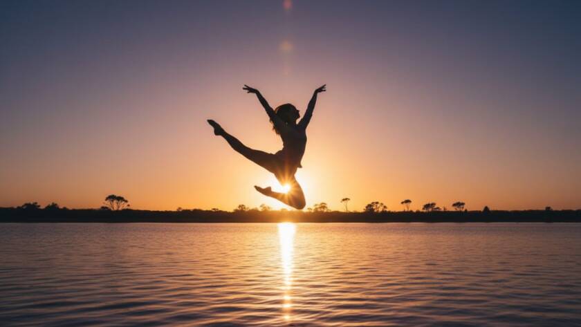A professional, colour-graded photograph capturing dynamic dance in Seabrook's natural light, featuring a contemporary dancer mid-air in an awe-inspiring leap, silhouetted against a golden hour sunset over Point Cook Coastal Park in Seabrook, Victoria, showcasing dramatic motion and artistic grace.