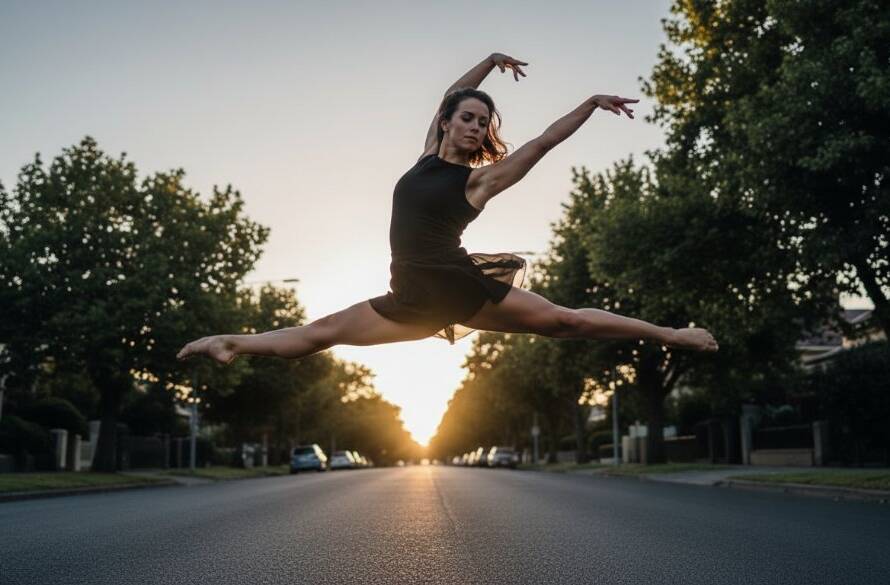 An epic moment of a contemporary dancer captured during a dynamic Mont Albert dance photography session, mid-air in a powerful leap, silhouetted against a dramatic sunset glow near a heritage Mont Albert park.