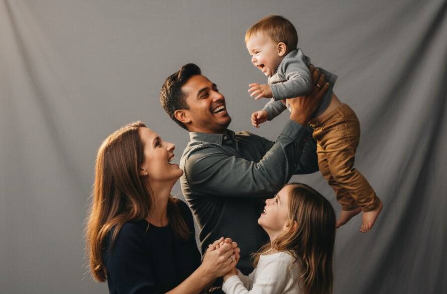 An emotionally resonant, epic moment captured in a professional studio, showcasing a family joyfully embracing during a 'Capturing family milestones studio photography Sunshine North' session, with dramatic, soft lighting illuminating their genuine expressions, celebrating a significant life event.