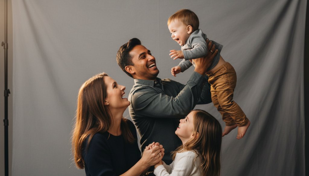 An emotionally resonant, epic moment captured in a professional studio, showcasing a family joyfully embracing during a 'Capturing family milestones studio photography Sunshine North' session, with dramatic, soft lighting illuminating their genuine expressions, celebrating a significant life event.