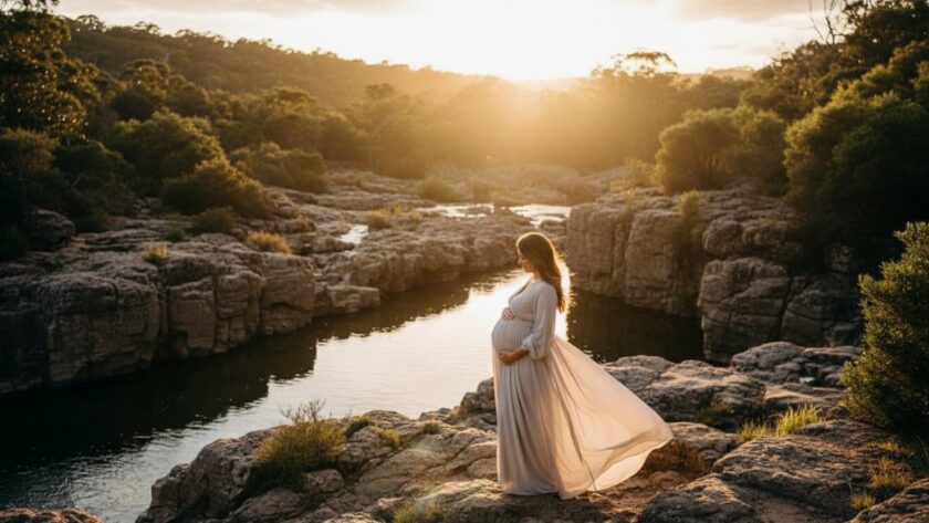 A stunning 'epic moment' style photograph of an expectant mother in Hamlyn Heights, Victoria, showcasing her radiant pregnancy glow against a dramatic sunset backdrop near Buckley Falls. The composition highlights her silhouette and the natural beauty of the surroundings, perfectly capturing radiant maternity photos in Hamlyn Heights Victoria.