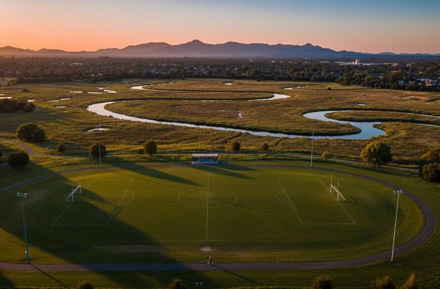 A stunning aerial view showcasing capturing Rowville's scenic beauty with drone photography, with golden hour light illuminating Llewellyn Park and surrounding natural landscapes, creating an epic, professional, and color-graded cinematic photograph.
