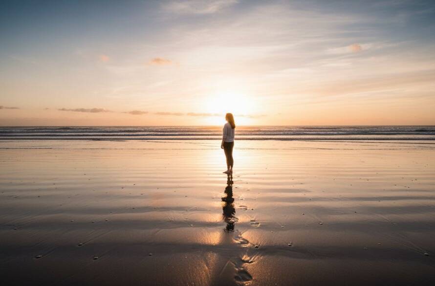 A breathtaking wide-angle, cinematic shot showcasing the serene beauty of Chelsea Beach fine art photography Melbourne at dawn, with soft golden light illuminating gentle waves and a lone figure in the distance, evoking a sense of tranquility and artistic wonder.