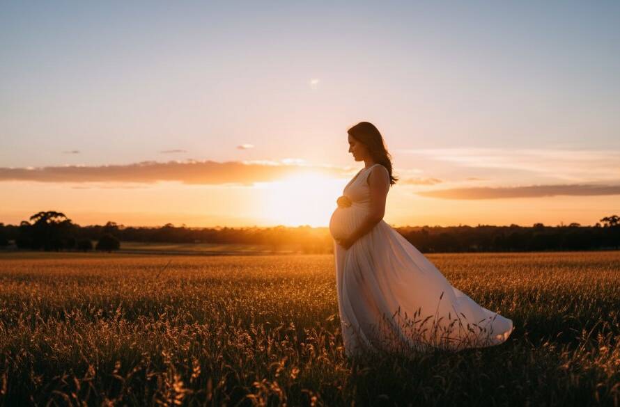 A breathtaking panoramic shot from a cherished Braeside maternity photography session, featuring an expectant mother silhouetted against a golden sunset over Braeside Park, her pregnant belly gently illuminated, capturing her radiant glow in an epic moment.
