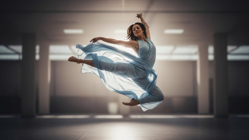 An inspiring dynamic dance photography moment in Churchill, Victoria, capturing an aspiring artist mid-leap with dramatic, ethereal lighting against a soft, blurred background, showcasing their power and grace.