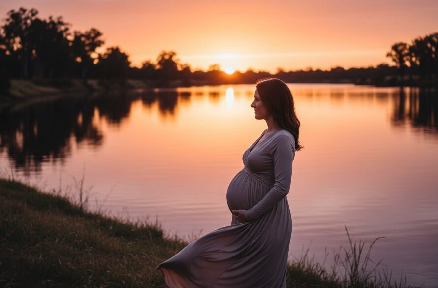 An epic, cinematic maternity photograph featuring an expectant mother silhouetted against a breathtaking River Murray sunset in Cobram, Victoria, Australia, capturing the serene and magical glow of Cobram Maternity Photography River Murray Sunset Magic.