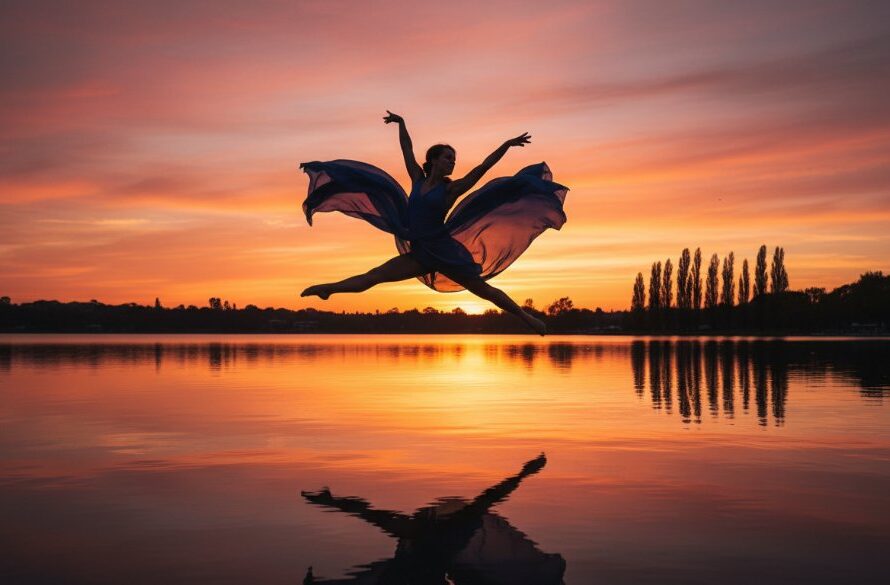 A powerful contemporary dance photography Lake Wendouree foreshore image capturing a female dancer mid-air in a dramatic leap at sunset, with the iconic lake and trees silhouetted in the background, showcasing incredible grace and athletic power.