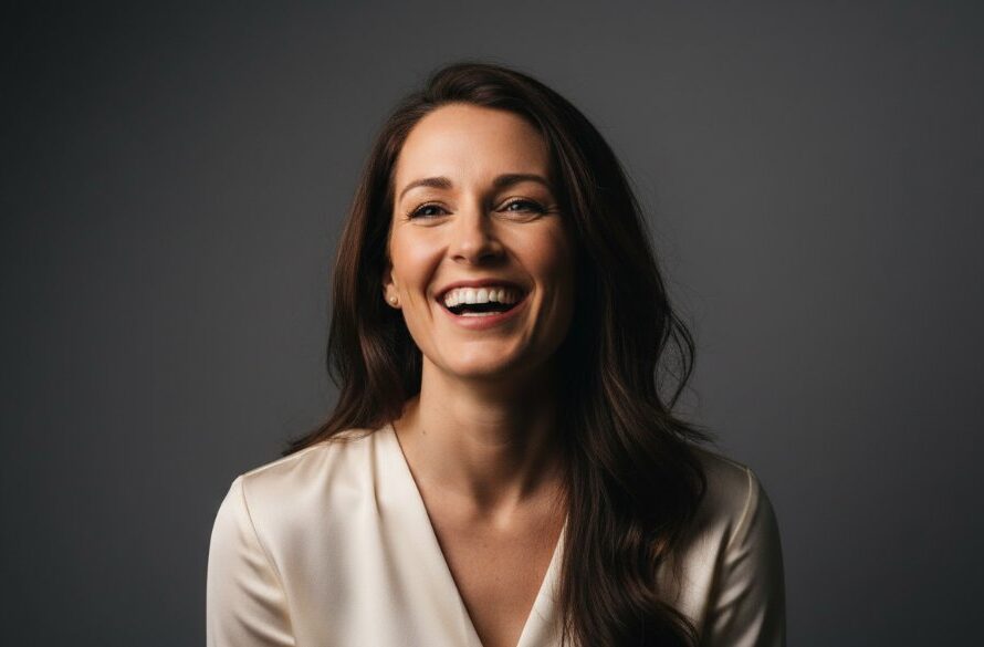 A powerful, dramatically lit close-up of a person laughing joyfully in a professional studio setting, capturing an authentic, epic moment of emotion, embodying creative studio portraits Seymour Victoria.