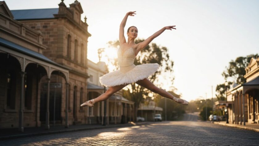 A professional, color-graded photograph capturing an elegant ballet dancer mid-air in a powerful leap, set against the soft, historic backdrop of Creswick's forgotten gold rush architecture bathed in golden hour light. This Creswick Dance Photography Captures Ballet Grace Victoria image embodies dynamic movement and artistic expression, showcasing incredible athleticism and grace.