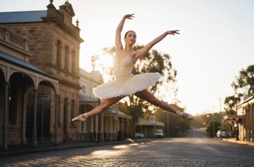 A professional, color-graded photograph capturing an elegant ballet dancer mid-air in a powerful leap, set against the soft, historic backdrop of Creswick's forgotten gold rush architecture bathed in golden hour light. This Creswick Dance Photography Captures Ballet Grace Victoria image embodies dynamic movement and artistic expression, showcasing incredible athleticism and grace.