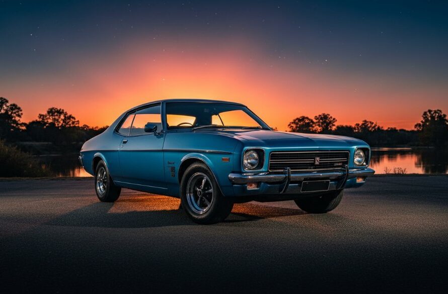 A stunning, dramatic twilight automotive photography Mooroopna Victoria shot, featuring a sleek, vintage muscle car bathed in the last golden rays of sunset, parked near the Goulburn River with subtle reflections.