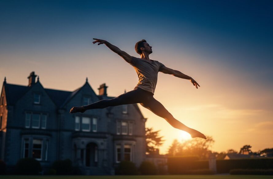 A male dancer mid-air in a powerful leap against a soft-focus backdrop of Drumcondra's historic architecture at sunset, capturing Drumcondra dance photography epic moments with dramatic lighting.
