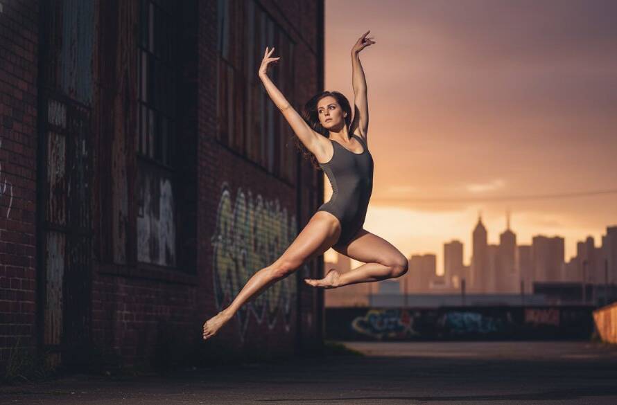 A powerful and artistic shot of a dancer mid-leap against an industrial Brooklyn, Victoria, Australia backdrop, expertly captured for dynamic dance photography Brooklyn Victoria Australia, showcasing an epic moment of strength and grace with dramatic lighting.