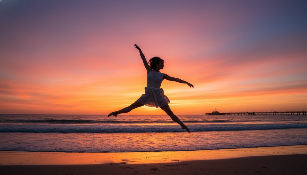 A female dancer in mid-air performing a powerful, graceful leap against the vibrant sunset hues over Carrum foreshore, epitomizing dynamic dance photography Carrum foreshore with dramatic lighting and professional artistry.