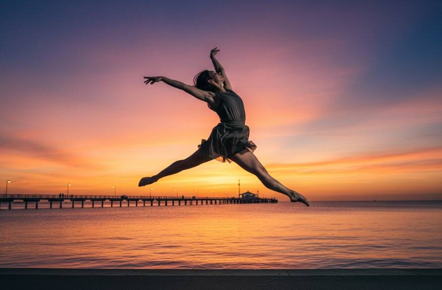 A stunning dynamic dance photography Frankston pier sunset shot, featuring a dancer in mid-air against a vibrant sky, capturing an epic moment of strength and grace.
