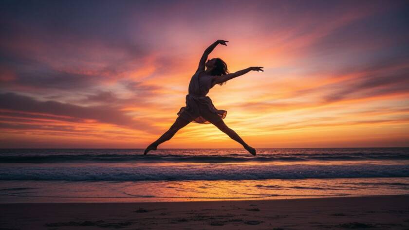 Dynamic dance photography Hampton Victoria capturing a breathtaking leap by a contemporary dancer at sunset on Hampton Beach, showcasing powerful athleticism and grace against a vibrant sky.