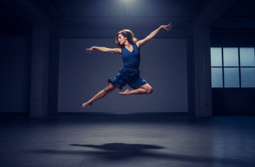 A breathtaking 'epic moment' photograph showcasing a contemporary dancer in full extension mid-leap, dramatically lit against a deep blue backdrop, embodying dynamic dance photography Heatherdale Victoria.