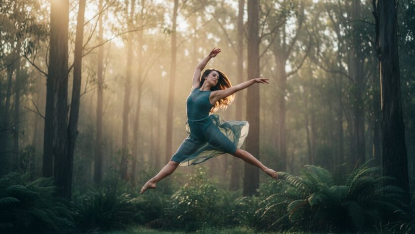 An artistic shot of a dancer mid-leap against a misty Hepburn Springs landscape, showcasing dynamic dance photography Hepburn Springs with dramatic lighting and professional colour grading.