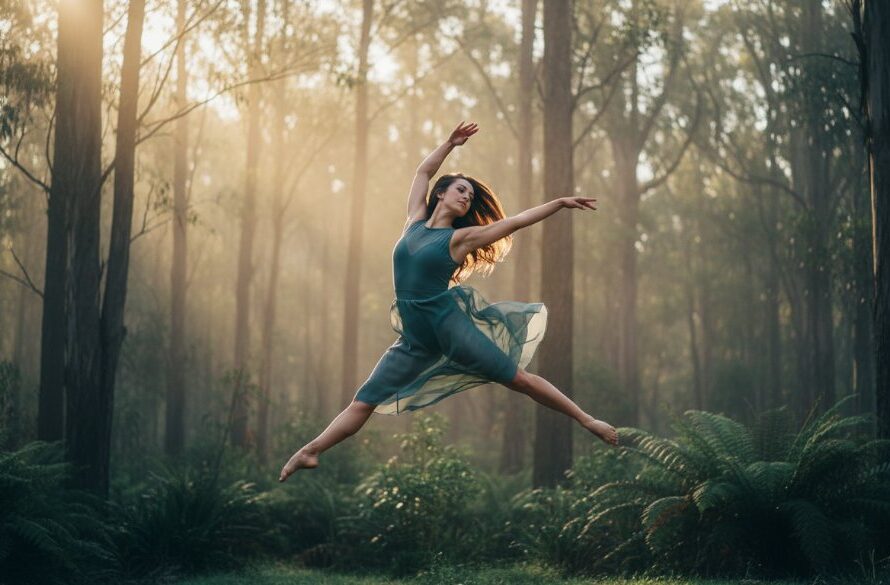An artistic shot of a dancer mid-leap against a misty Hepburn Springs landscape, showcasing dynamic dance photography Hepburn Springs with dramatic lighting and professional colour grading.